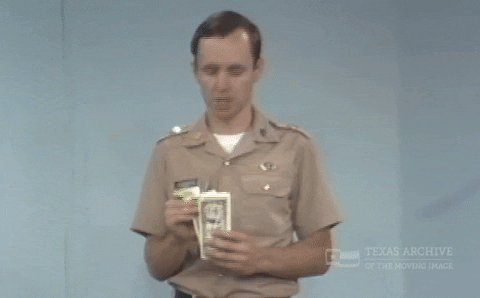 Person counting money and thinking through a budget decision