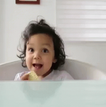 a gif of a toddler giving thumbs up