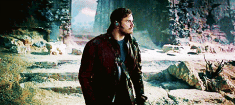 GIF of Star-Lord (Chris Pratt) dancing while walking around a planet in the beginning of Guardians of the Galaxy