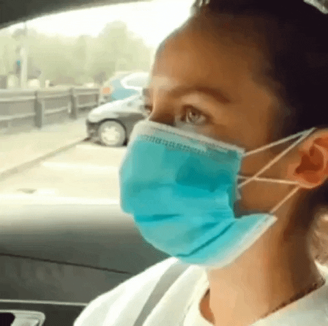 Woman Eating Food Through Face Mask