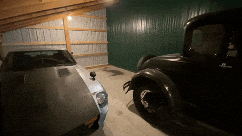 car being pushed into place in garage