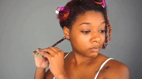 Daye La Soul sealing her twists for her twist out.