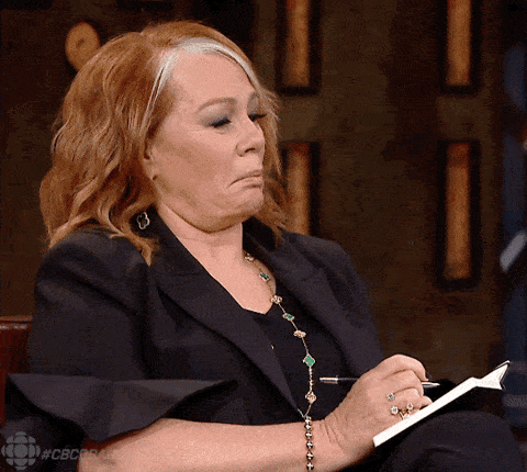 Person writing in a notebook late at night, planning an important decision