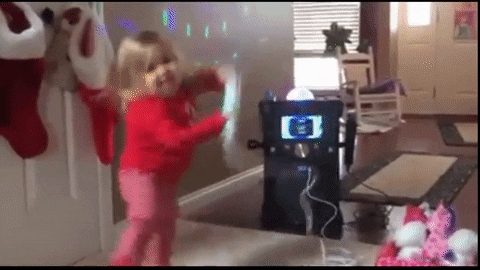 Little girl dancing and doing karaoke