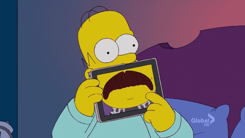 homer simpson holdin a tablet and simulating different faces