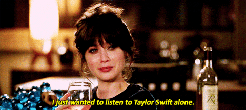 Jessica Day crying with wine wanting to listen to Taylor Swift alone.
