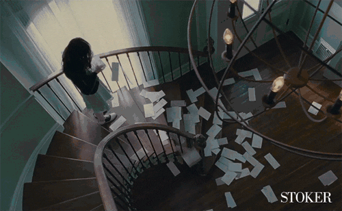 A Gif of a woman sorting through mail. 