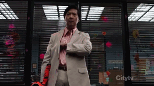 Senor Chang pulling paper out of his suit and dancing