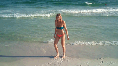 Girl jumping on the beach