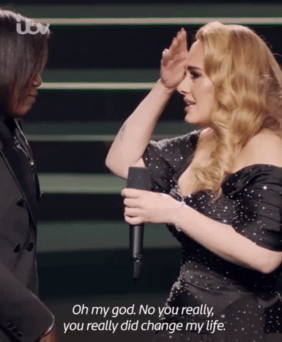 Gif of Adele on stage speaking to her high school English teacher, a surprise guest at a performance, with the line: "Oh my god. No you really, you  really did change my life."