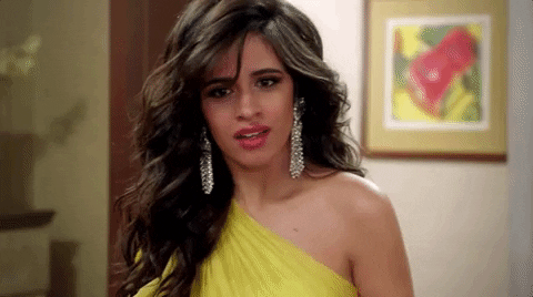 Camila Cabello, a woman in a yellow dress posing for a picture at a Quinceanera celebration