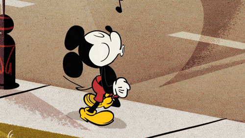 Mickey Mouse listening to Dance Monkey by Tones and I.