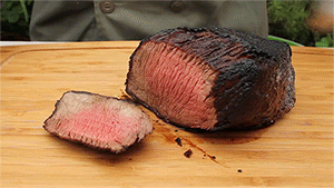 cutting a smoked meat