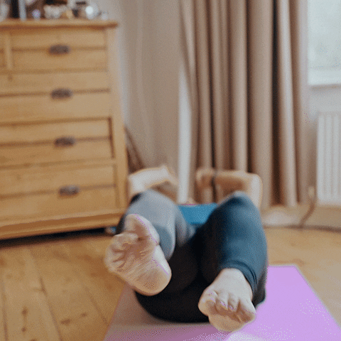 Gif of a woman working out at home