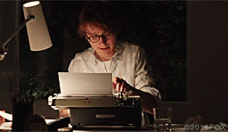 Man typing on a typewriter