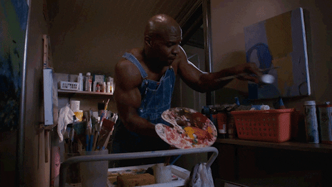 Terry Crews from Brooklyn 99 painting at home in attic