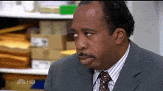 Stanley Hudson from The Office rolling his eyes with resigned acceptance
