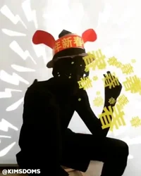 Seated silhouette in a red paper headpiece with Chinese lettering
