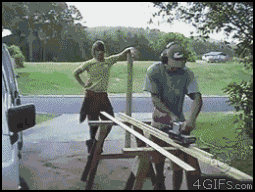 Animated GIF of a guy accidentally launching a board into his helper while power sanding.