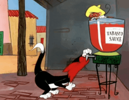 Cartoon cat downing tabasco sauce