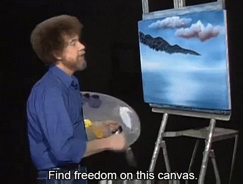 The artist Bob Ross painting on a canvas with the text "Find freedom on this canvas."