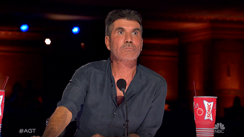 A GIF zooming on Simon Cowell with a shocked expression