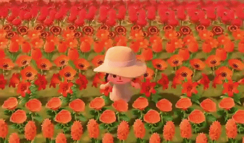 Girl running through rows of flowers