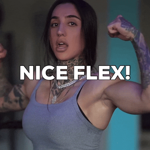 Bodybuilder smiling and flexing arm muscles
