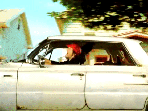 An animated gif from the Jason Mraz video for The Remedy, driving in the car singing along, carefree