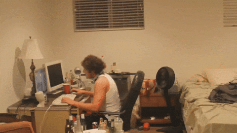 Guy frantically typing at night — wrong time to trade