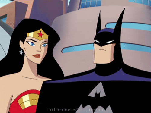 Wonder Woman kisses Batman on the cheek.