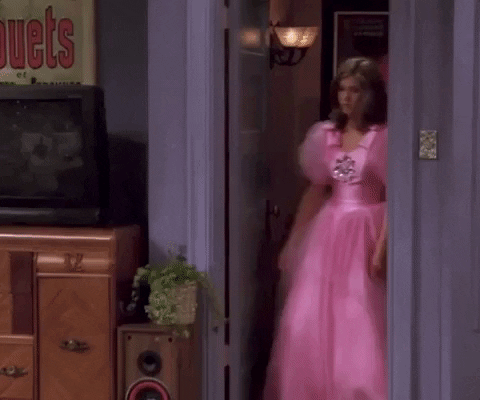 a gif from friends of Rachel walking out in ugly, pink dress