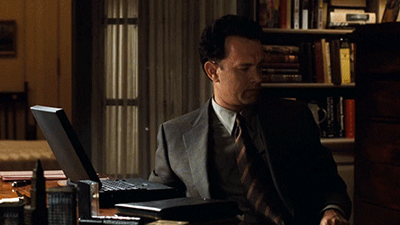Gif of a scene from the movie "You've got mail" showing Tom Hanks abandoning his purpose of writing on the Laptop