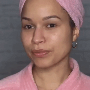Woman applying serum during self-care session