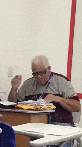 Teacher checking exam papers in funny gifs