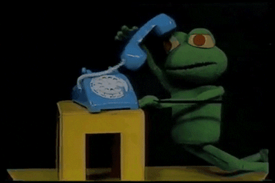 A stop motion frog picks up the phone and asks for help 
