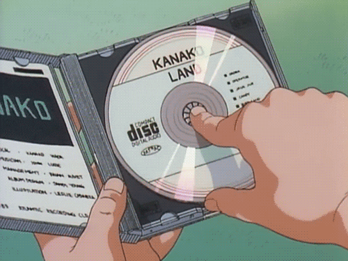 A gif of a manga character turning a CD over