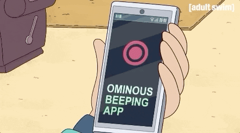 a hand holding a phone that reads "ominous beeping app"