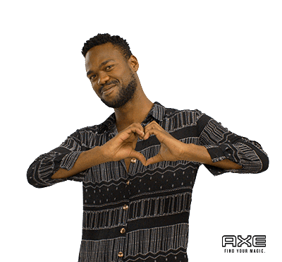 A man giving a heart gesture.