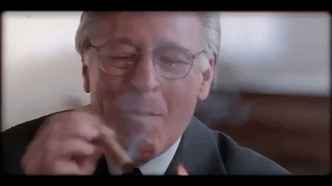 Greedflation: Business man smoking cigar and laughing