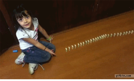 Gif of girl failing to knock down all dominoes