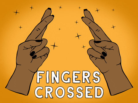 Medium Brown-skinned tone hands with black-painted fingers cross each other 