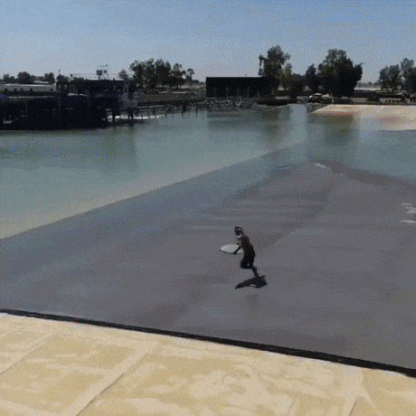 Surfer catching waves created by train in wow gifs