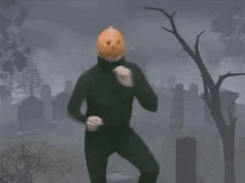 Dancing man with a pumpkin head