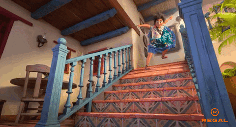 Mirabel sliding down the stairs inEncanto