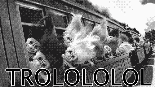 Trolls with long hair look out of a moving train. The caption reads 'Trolololol'.