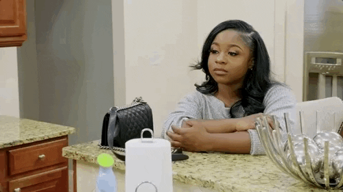 A gif of zoom into Reginae Carter's straight face