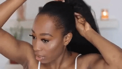 Clip the ponytail into place using the top and bottom clip-ins