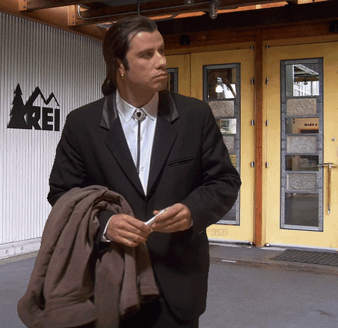 a confused John Travolta meme from Pulp Fiction outside a closed REI store