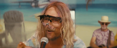 The Beach Bum Reading GIF by NEON - Find & Share on GIPHY